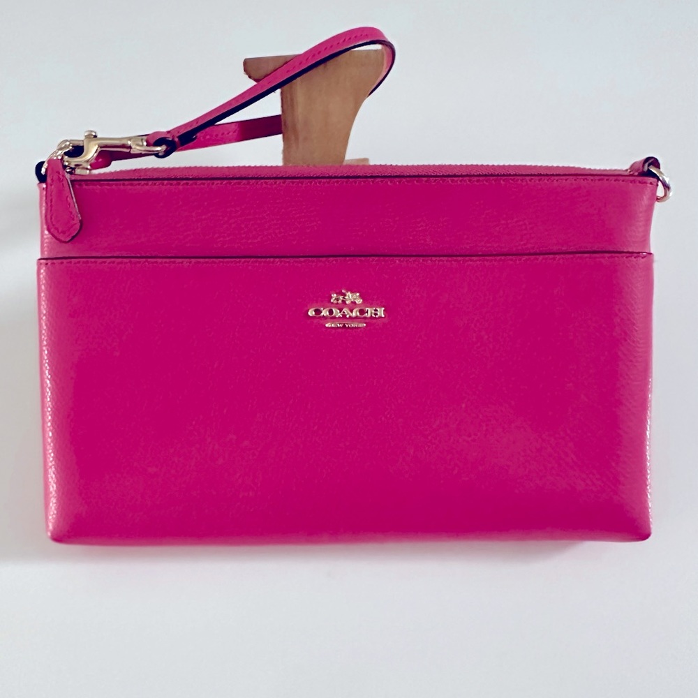 Coach: hot pink clutch